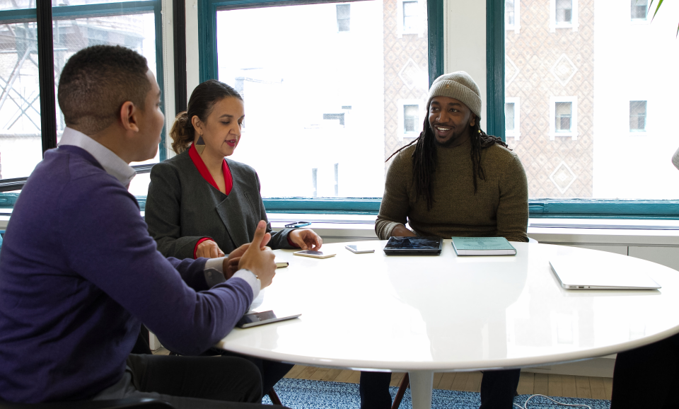 Consultants collaborating around a table